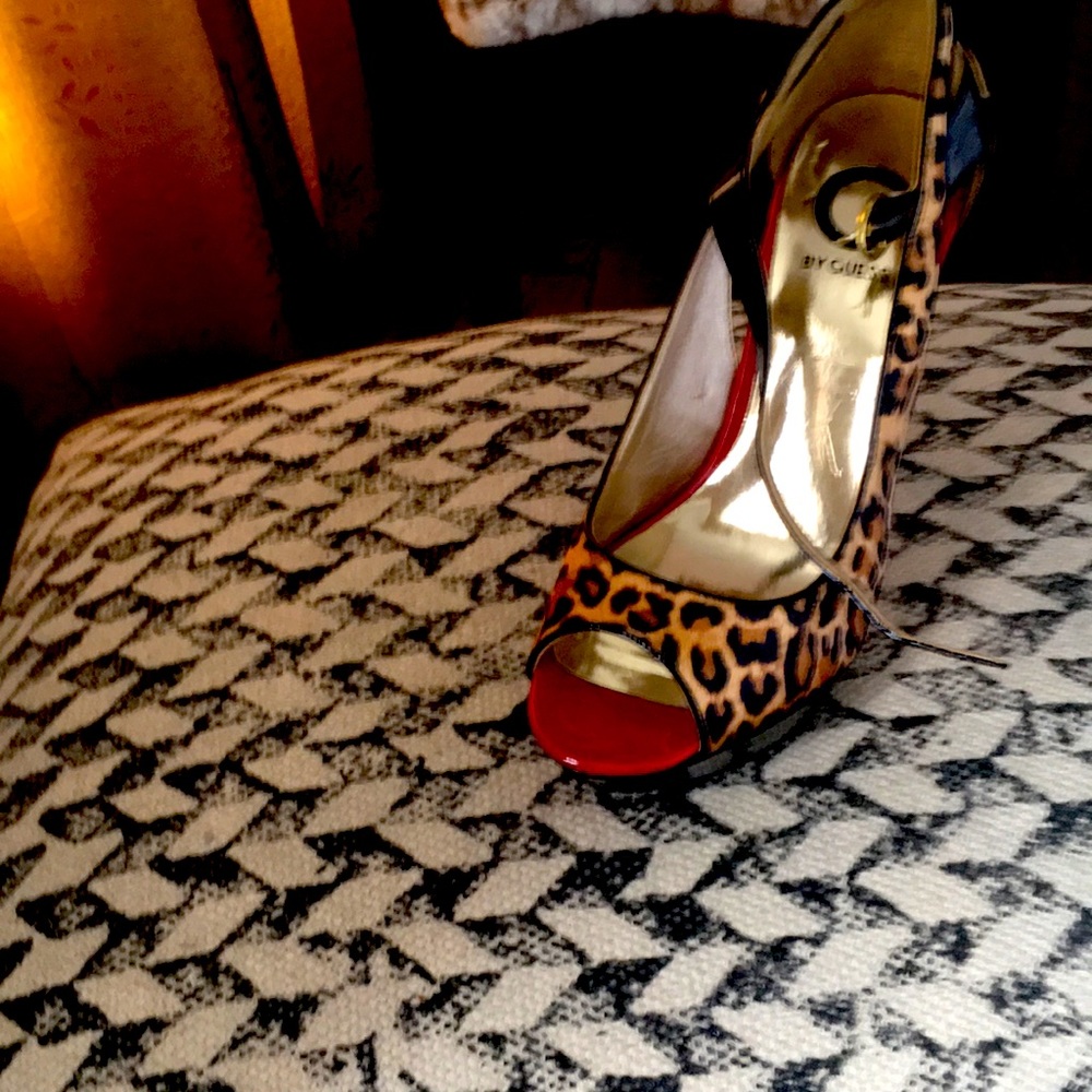 For sale leopard red and black high heel open toe shoe.